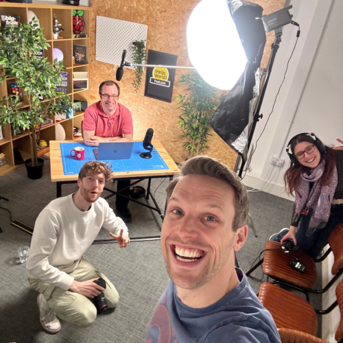 Behind the scenes image of the team recording an episode of the Hello World podcast.